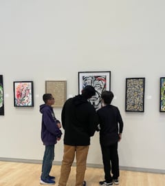 Students looking at art on a wall at the Yuma Art Center
